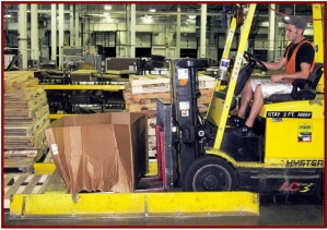 GM Recycling Cardboard Separate from Wooden Palate AutoInformed.com